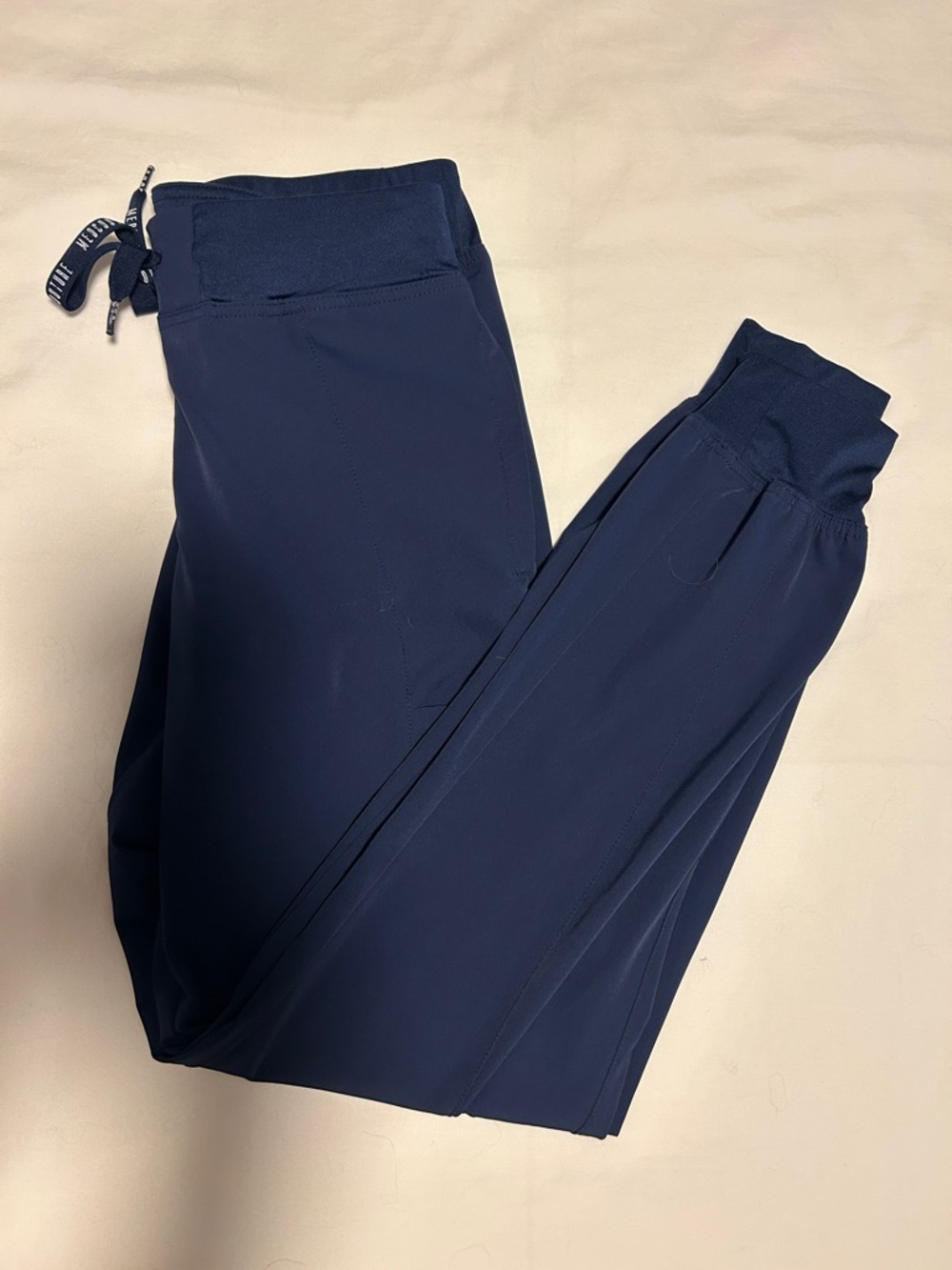 MedCouture navy “peaches” scrub pants